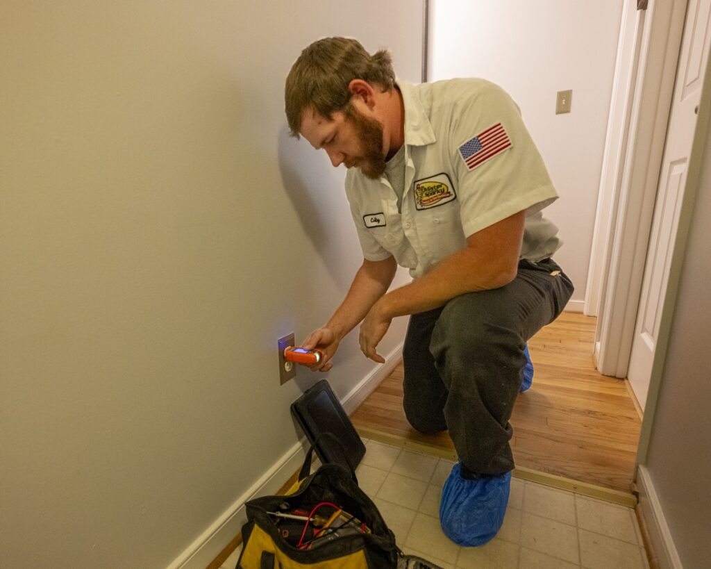 Mister Sparky electrician performing home safety inspection