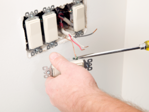 Electrician fixing open ground switch