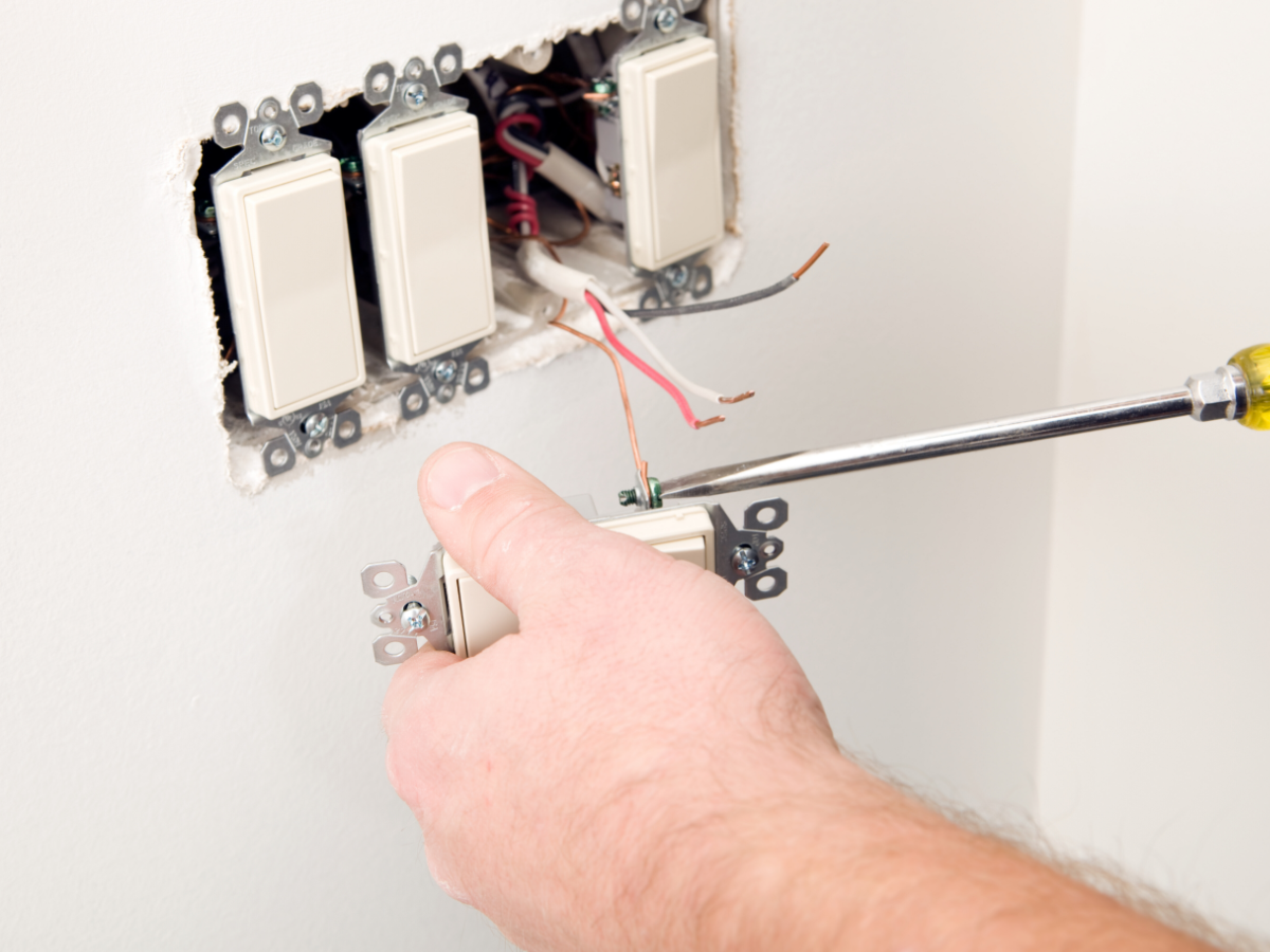 Electrician fixing open ground switch