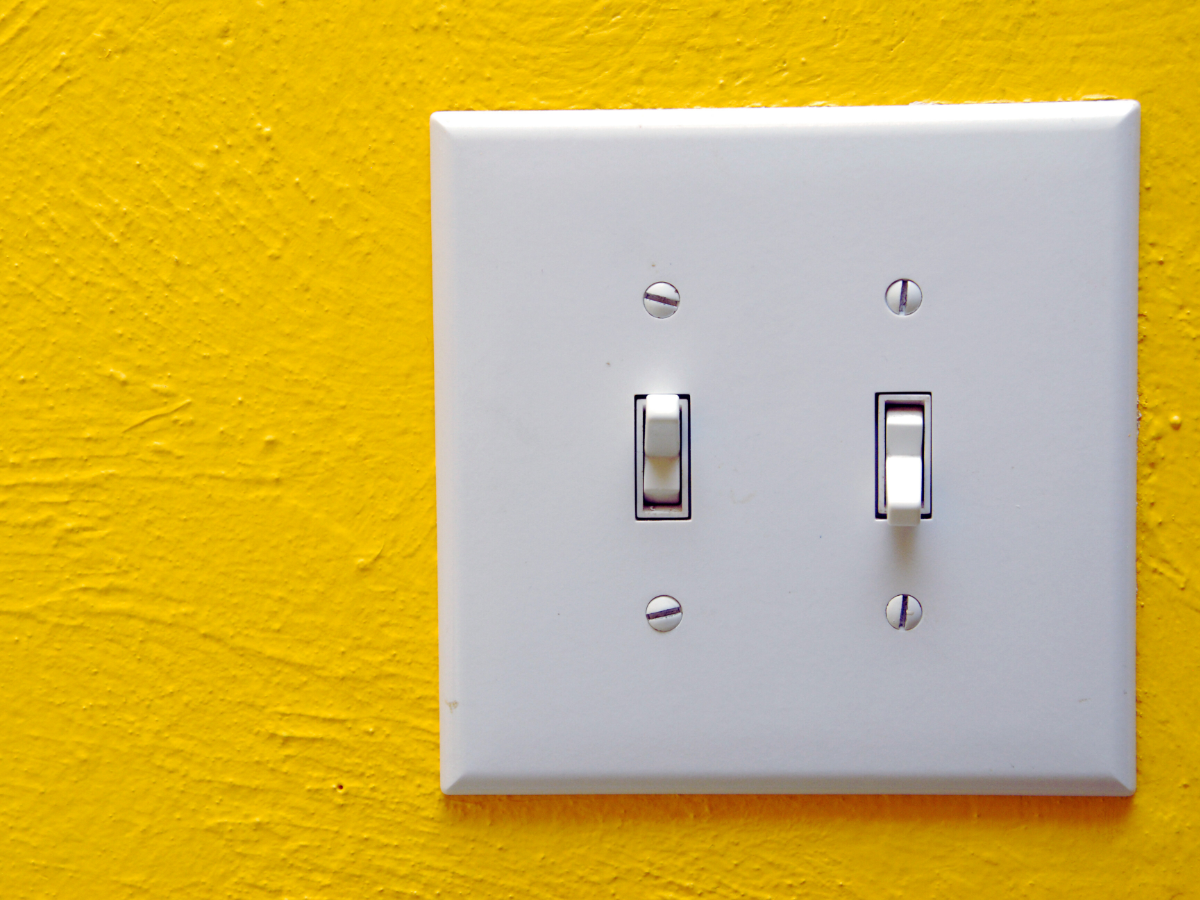 electrical switch on yellow wall