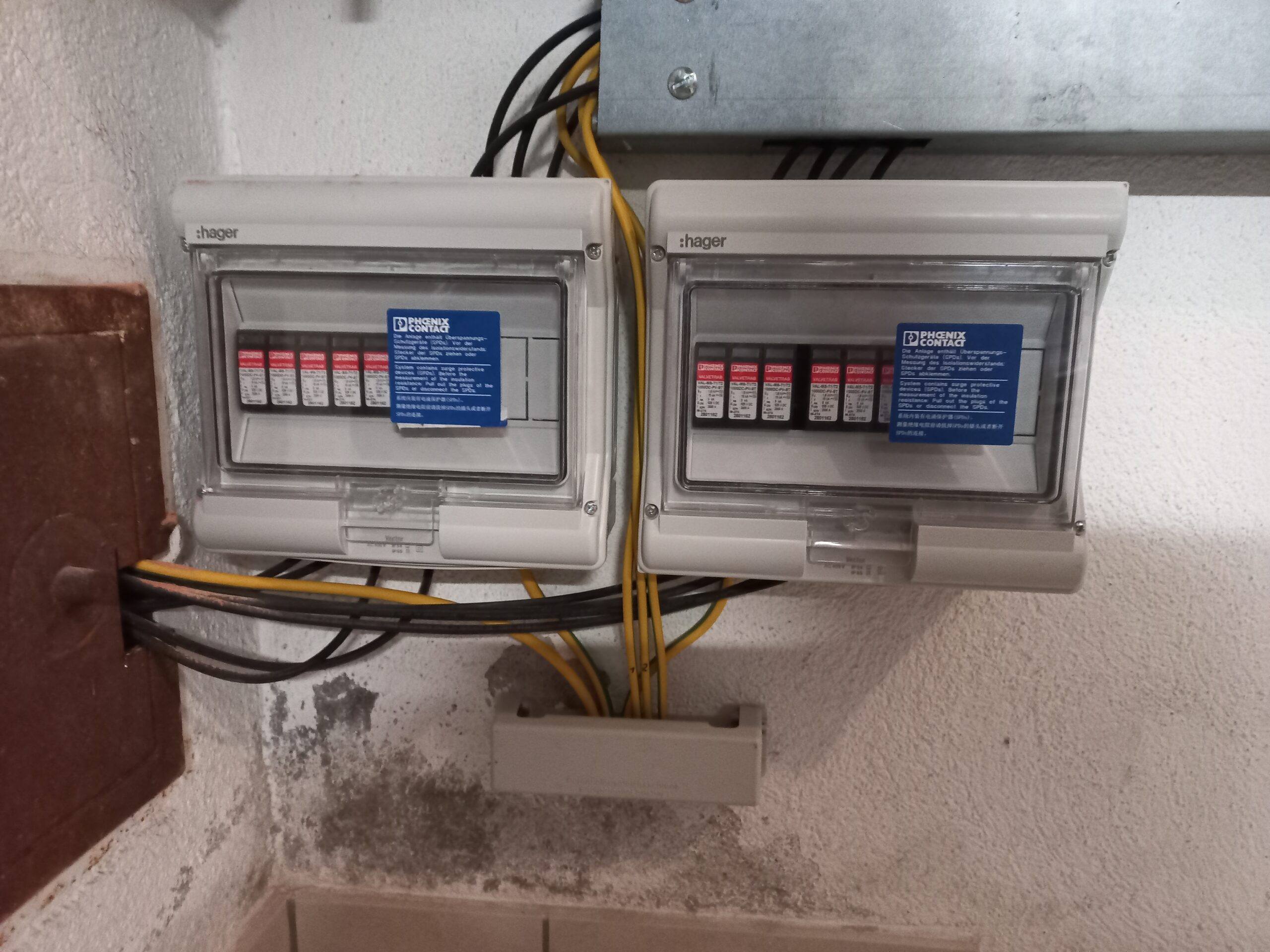 whole-house surge protectors installed underneath homeowners electrical panel